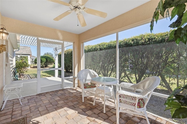 sunroom / solarium with ceiling fan