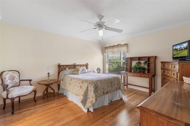 bedroom featuring crown molding, ceiling fan, a textured ceiling, and light hardwood / wood-style floors