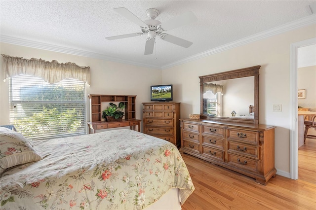 bedroom featuring crown molding, ceiling fan, a textured ceiling, and light hardwood / wood-style flooring