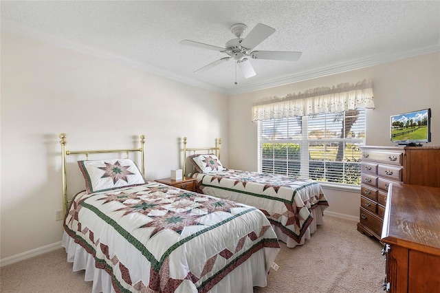 bedroom with crown molding, light colored carpet, ceiling fan, and a textured ceiling