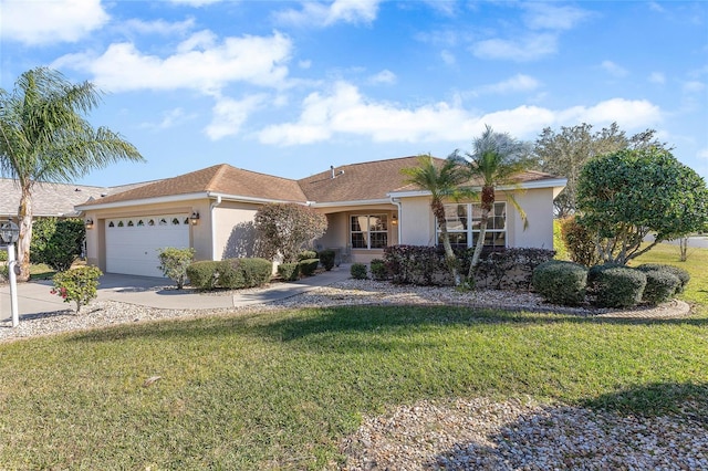 ranch-style house with a garage and a front yard