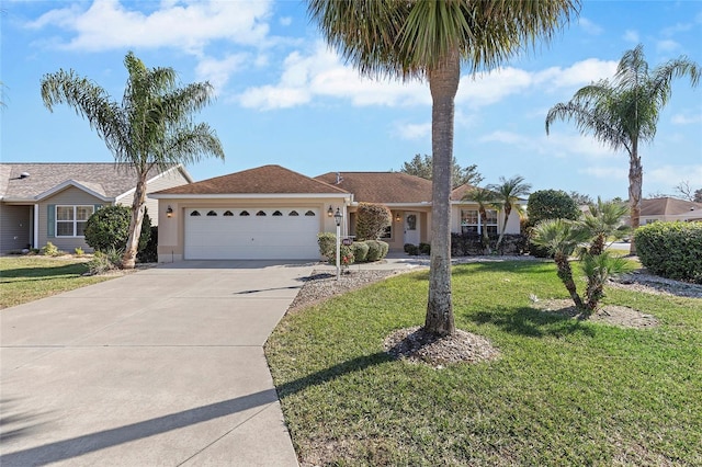 single story home featuring a garage and a front yard