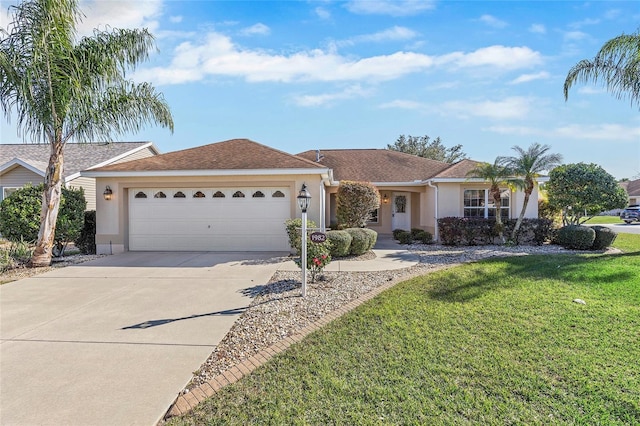 ranch-style house with a garage and a front lawn