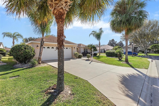 single story home featuring a garage and a front lawn