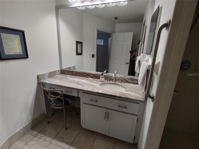 bathroom featuring vanity and tile patterned flooring