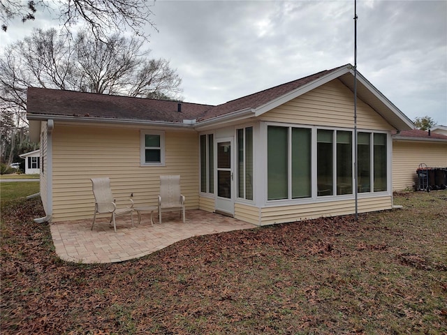 back of house with a patio