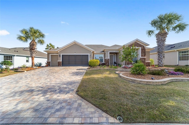 single story home with a front lawn and a garage