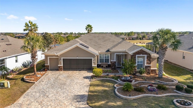 view of front facade featuring a front lawn and a garage