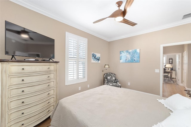 bedroom featuring ceiling fan and ornamental molding