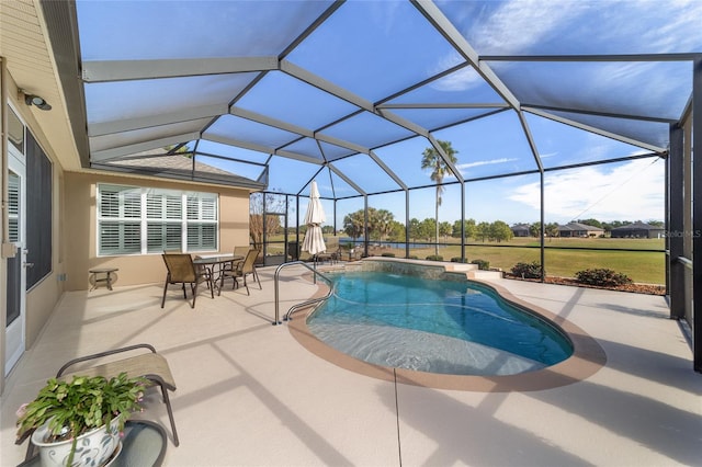 view of pool with a lanai and a patio