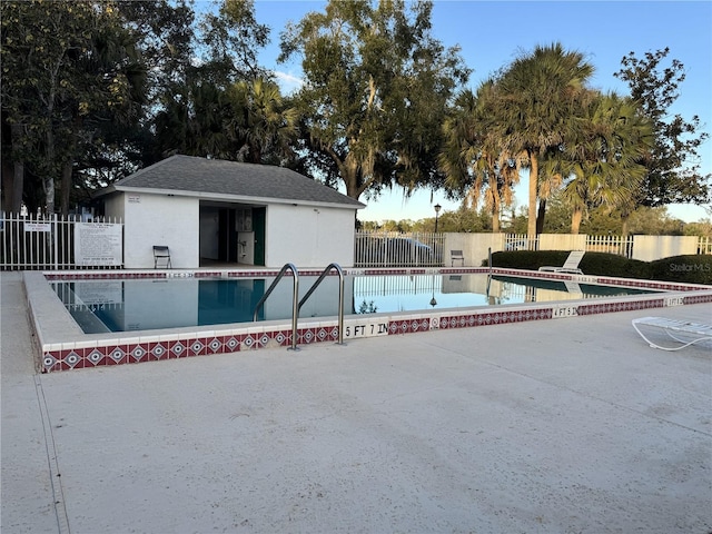 view of swimming pool with a patio area