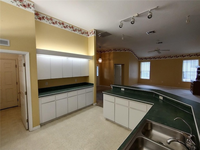 kitchen with white cabinetry and sink