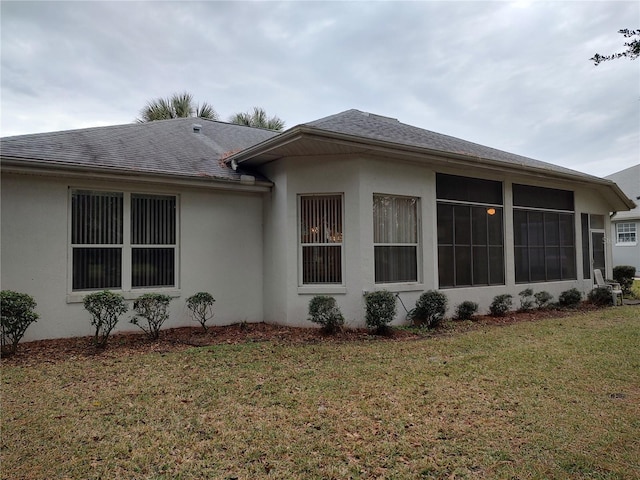 view of home's exterior featuring a lawn