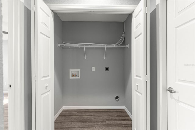 clothes washing area featuring washer hookup, hardwood / wood-style floors, and electric dryer hookup