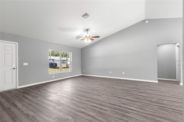 unfurnished living room featuring lofted ceiling, ceiling fan, and dark wood-type flooring