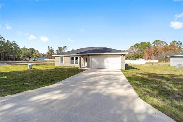 ranch-style house featuring a front yard and a garage