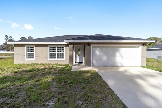 ranch-style house featuring a garage and a front yard