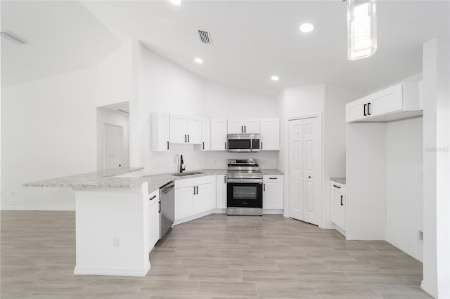 kitchen with sink, high vaulted ceiling, kitchen peninsula, stainless steel appliances, and white cabinets