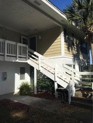 view of home's exterior with a balcony