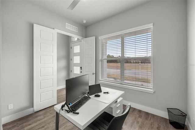 home office featuring ceiling fan and hardwood / wood-style floors