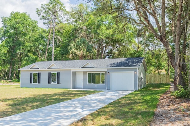 single story home with a garage and a front lawn