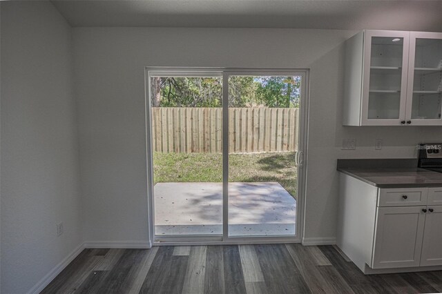 doorway to outside featuring dark hardwood / wood-style floors