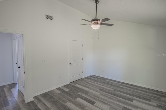 spare room with high vaulted ceiling, ceiling fan, and hardwood / wood-style flooring