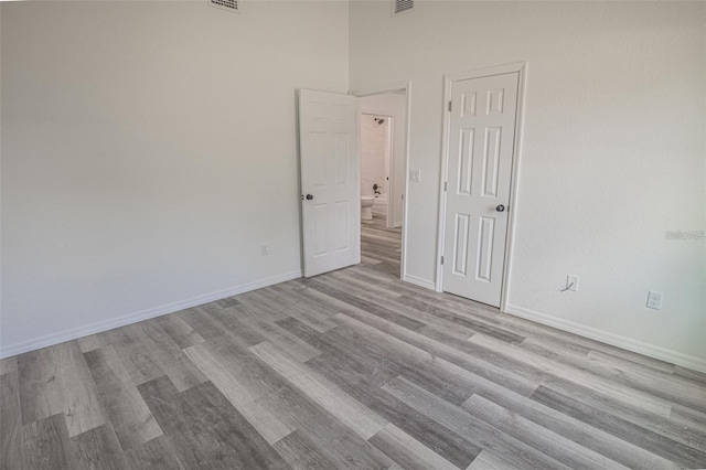 empty room with light hardwood / wood-style floors