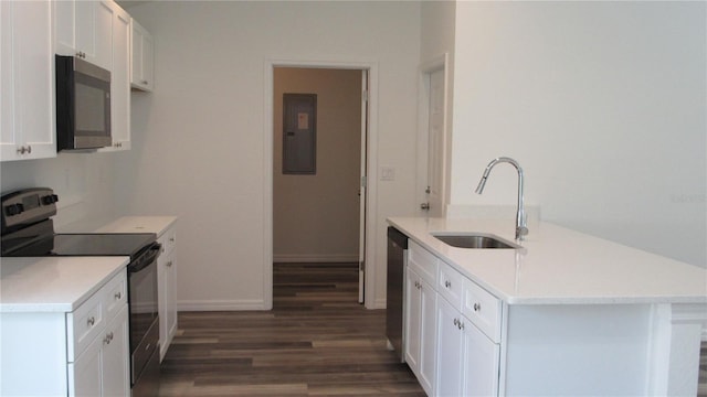 kitchen with stainless steel appliances, light countertops, and white cabinets