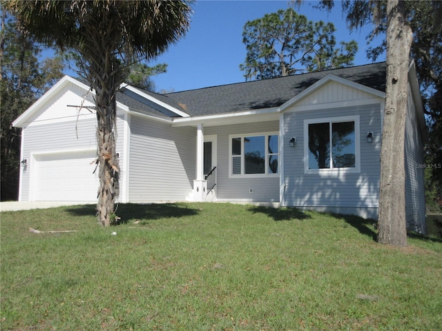 single story home with a garage and a front lawn