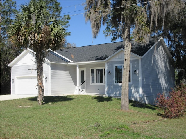 ranch-style home with driveway, a front lawn, an attached garage, and a shingled roof