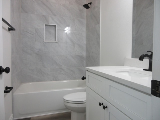 bathroom with toilet, bathtub / shower combination, and vanity