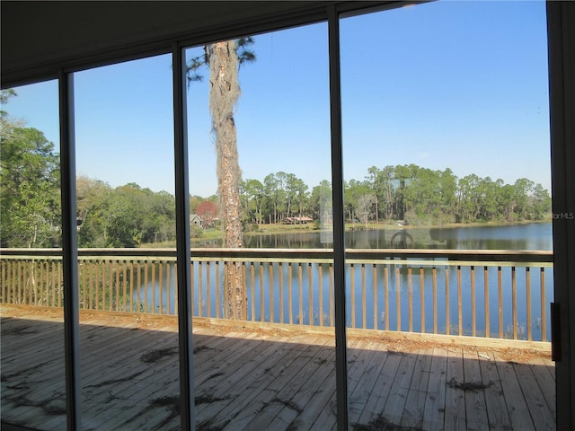 unfurnished sunroom with a water view and a wealth of natural light