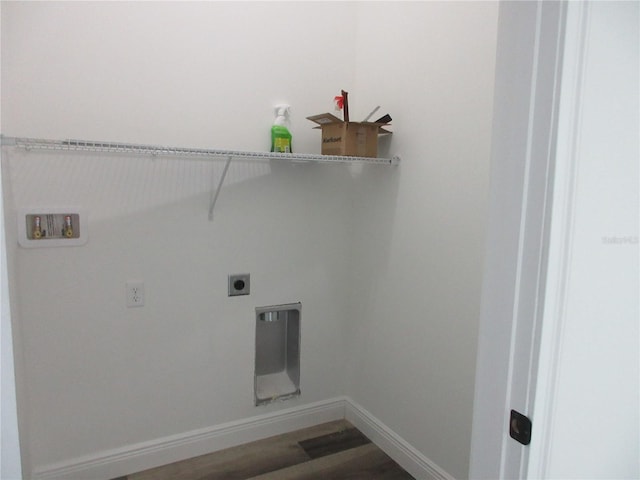 washroom with hookup for a washing machine, electric dryer hookup, wood finished floors, laundry area, and baseboards