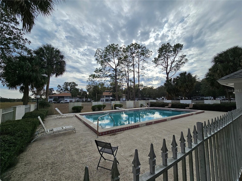 view of swimming pool featuring a patio