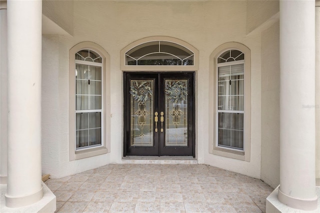 property entrance featuring french doors