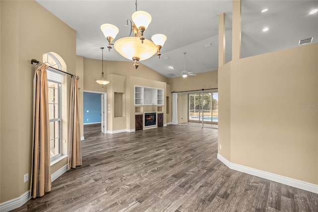 unfurnished living room featuring high vaulted ceiling, wood-type flooring, and ceiling fan with notable chandelier