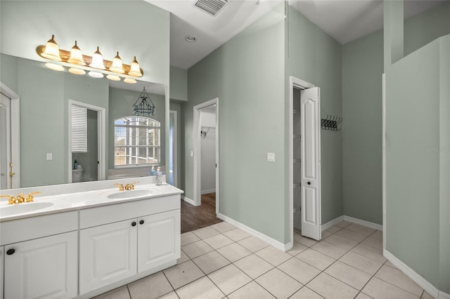 bathroom with vanity and tile patterned flooring