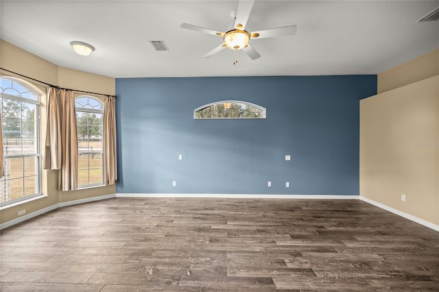 unfurnished room featuring ceiling fan and hardwood / wood-style floors