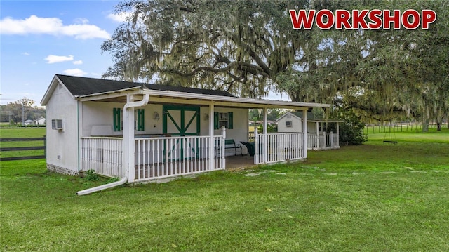 view of front facade with covered porch and a front yard