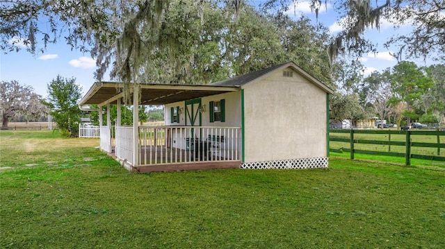 view of property exterior with a lawn