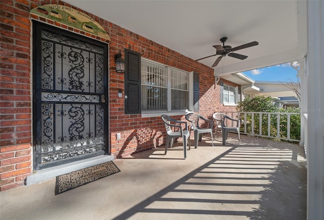 property entrance with a porch and ceiling fan