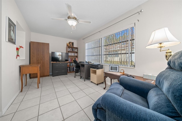 tiled living room with ceiling fan