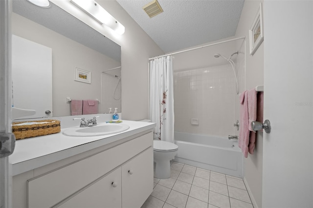 full bathroom with tile patterned flooring, vanity, shower / bath combination with curtain, a textured ceiling, and toilet