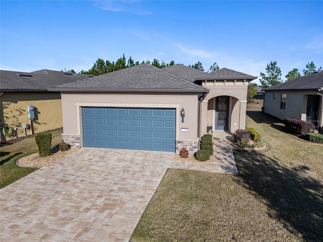 view of front of home featuring a front yard and a garage