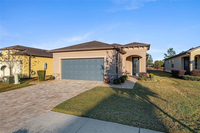 view of front of property featuring a garage and a front lawn