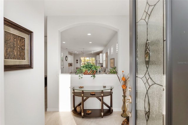 corridor featuring light tile patterned floors