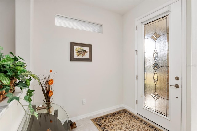 tiled foyer entrance with a wealth of natural light