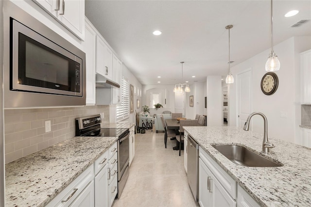 kitchen with sink, white cabinets, and stainless steel appliances