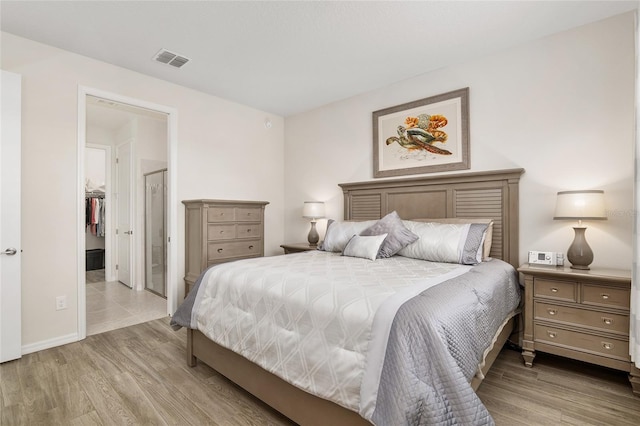 bedroom with light hardwood / wood-style floors